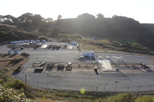 A missile site with concrete pads and railings spread across a hillside.
